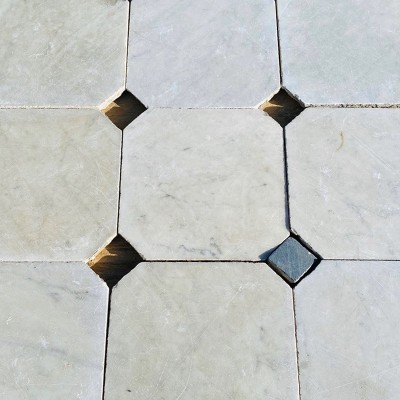 Antique marble floor with black corner squares