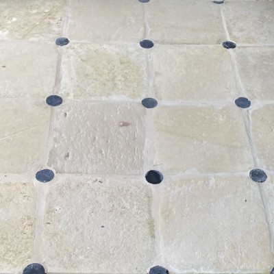Antique Limestone flooring with round cabochons
