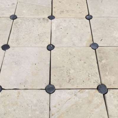 Antique Limestone flooring with round cabochons