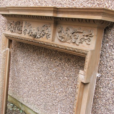Ornate carved pine fire surround in the Georgian manner