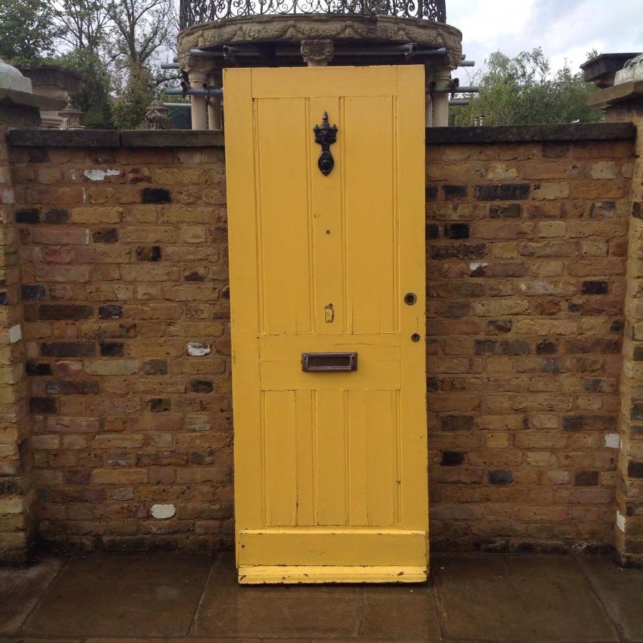 A Yellow Reclaimed Hardwoord Front Door
