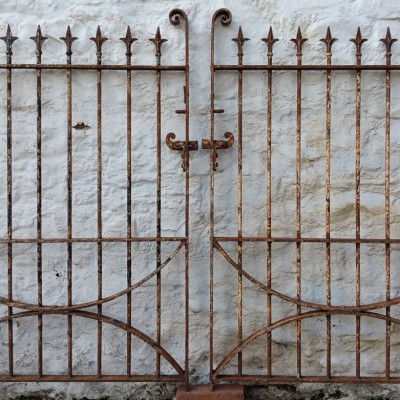 A  matching pair of single Victorian wrought iron pedestrian gates 
