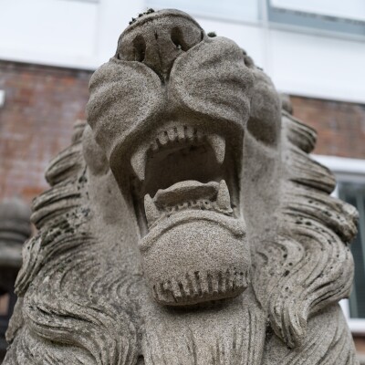 Reclaimed Pair of Monumental Stone Lions on their own Plinth