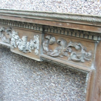 A fine English George III style carved pine chimneyneypiece