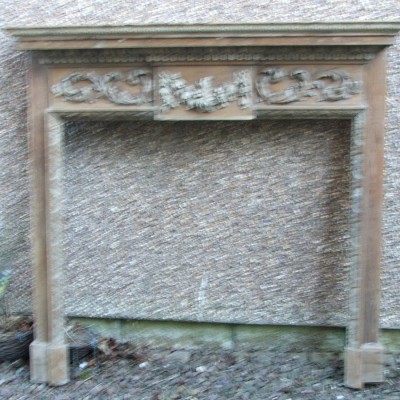 A fine English George III style carved pine chimneyneypiece